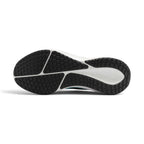 Displays the full-length black and white rubber Waffle sole, showcasing the multi-directional traction lug pods, deep central decoupling groove, and recessed white midsole cavity featuring a tonal Nike Swoosh.