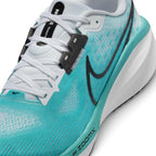 Details the forefoot construction, showing the open-weave engineered mesh toe box, embroidered mini black toe Swoosh, white eyestays with dark grey stitched reinforcement anchors, and the teal ZoomX midsole forefoot boundary.