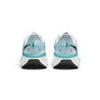 Focuses on the rear profile, displaying the light turquoise mesh heel counter with dual reflective circle pods, vertical teal heel tab with mini black Swooshes, teal stability rim, and flared white Cushlon 3.0 foam base.