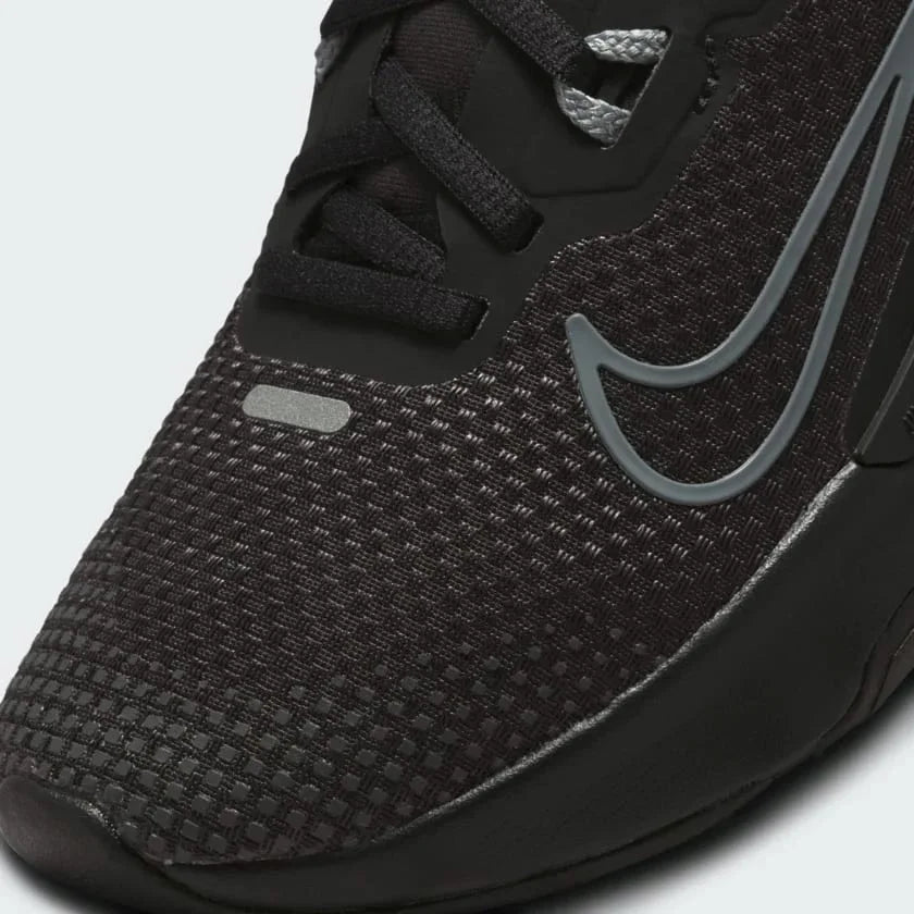 Close-up zoom on the front of the Nike Juniper Trail 2 Gore-Tex Women's black trainers, showing the reinforced toe cap, waterproof upper texture, and lacing system.
