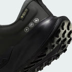 Detailed zoom on the outsole and midsole of the Nike Juniper Trail 2 Gore-Tex Women's black trainers, highlighting the cushioned foam and aggressive rubber outsole.