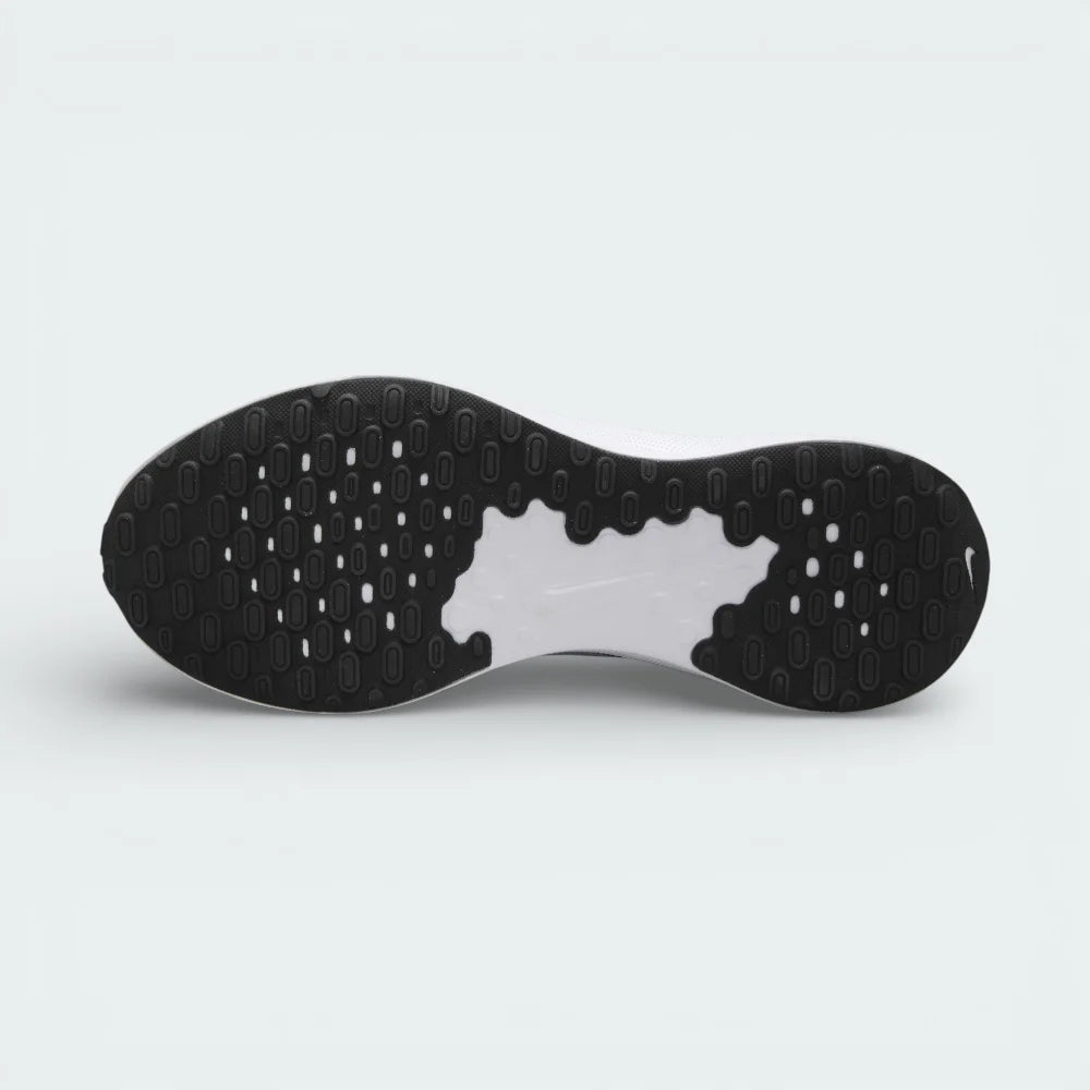 View of the rubber outsole of the Nike FB2207 007, showcasing the data-driven traction pattern and flex grooves for natural foot movement.