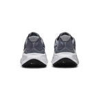Rear view of the sneakers emphasizing the reinforced heel structure, supportive rear padding, and ground contact sole wrap.