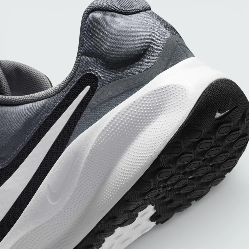 Detailed zoom on the side of the shoe, highlighting the soft foam midsole construction and the transition to the durable rubber outsole.