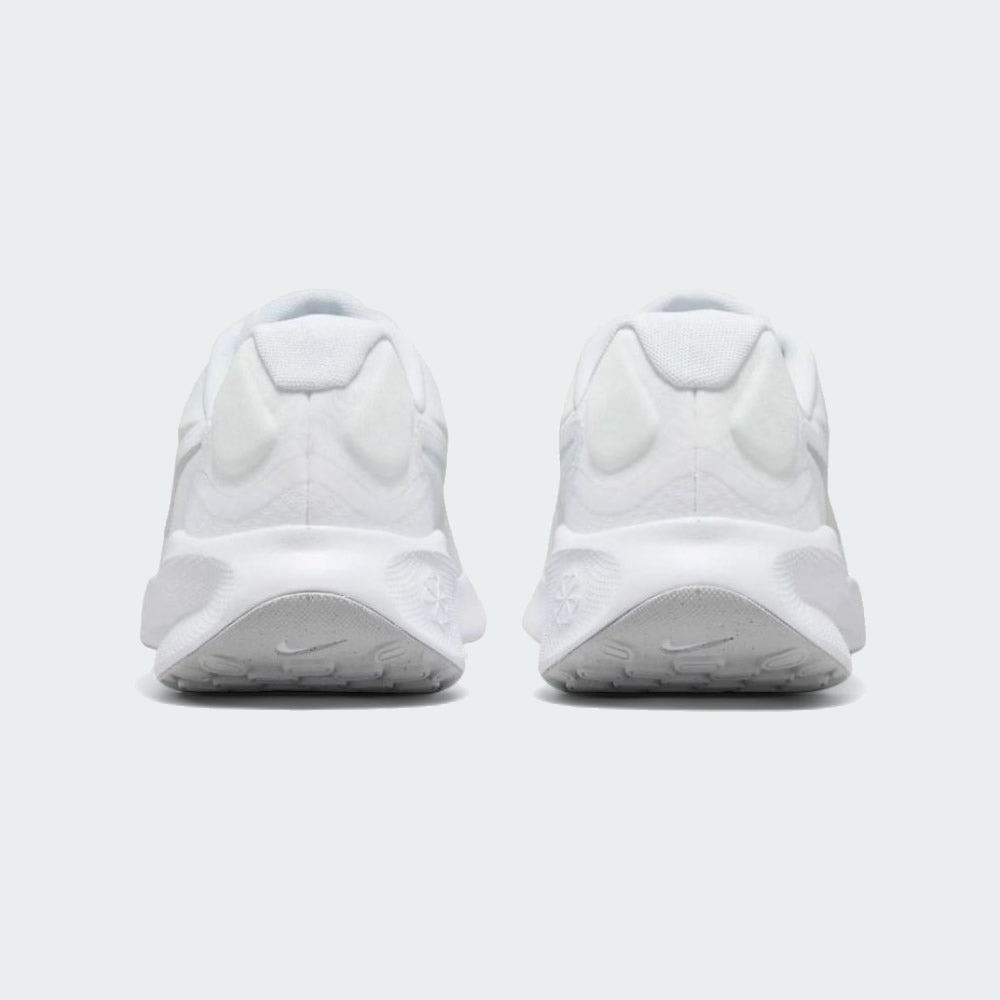 Rear view of the Nike Revolution 7 Men's white running trainers, focusing on the structured heel and subtle branding.