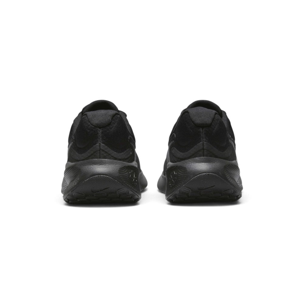 Focuses on the rear profile, displaying the visible external Achilles heel puffs, supportive heel structure, and the wide flared base of the foam midsole.