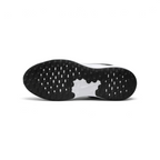 View of the black rubber outsole, showcasing the updated traction pattern and flexible grooves for a natural stride.