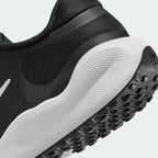Detailed zoom on the midsole area, highlighting the plush foam texture and the transition to the durable rubber outsole.