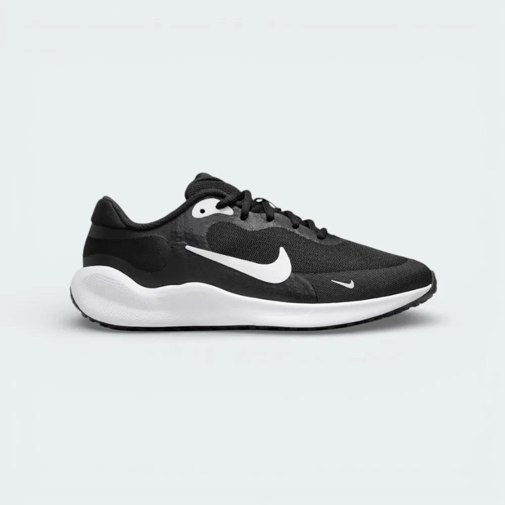 Side profile of the Nike Revolution 7 Juniors' trainers in black, showing the large white Swoosh and the clean, contoured black foam midsole.