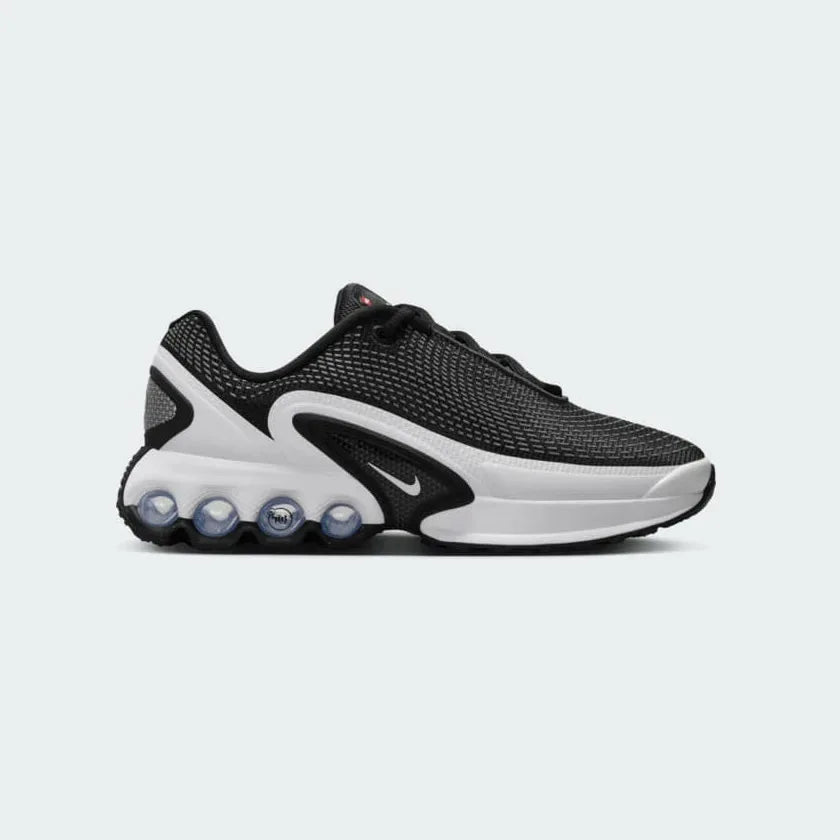 Nike Air Max DN Juniors Casual Trainers FB8987-003 side view showing sleek black upper and visible Air cushioning Main image