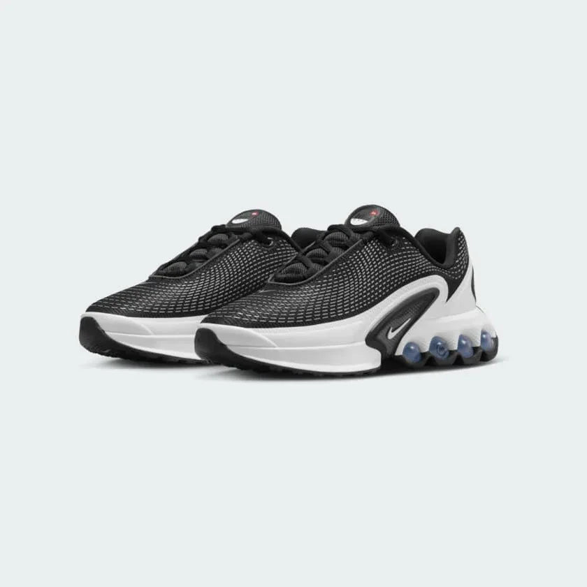 Nike Air Max DN Juniors Casual Trainers FB8987-003 angled view showing layered textures and sculpted midsole