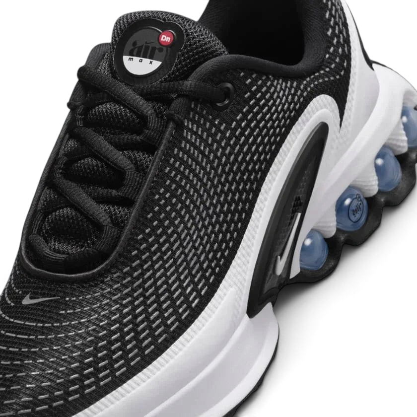 Close-up of Nike Air Max DN Juniors Casual Trainers FB8987-003 laces, mesh upper, and branding