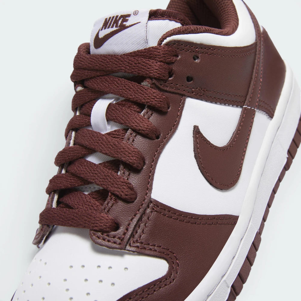 Details the premium double-stitching lines tracking around the reinforced red leather toe cap protection matrix and the clean configuration of the lace eyelets.