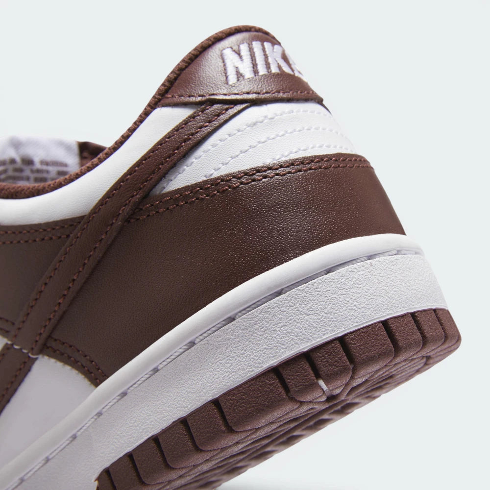 Highlights the "unreal" clean finish where the high-walled rubber cupsole midsole bonds securely to the tough leather upper framework.