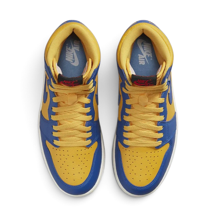 Top-down view of a pair of Air Jordan 1 Hi Retro OG Women's trainers in yellow and blue, highlighting their classic silhouette and lace-up closure.