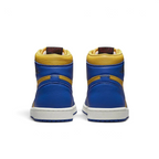 Rear view of the Air Jordan 1 Hi Retro OG Women's yellow/blue trainers, focusing on the Wings logo on the ankle collar and contrasting heel panels.
