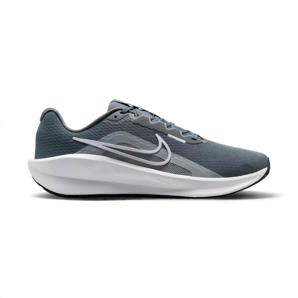 Displays the full lateral silhouette featuring the breathable Cool Grey mesh upper, outlined White Nike Swoosh, thick white sculpted foam midsole, supportive Wolf Grey eyelet overlays, and durable black rubber outsole rim.