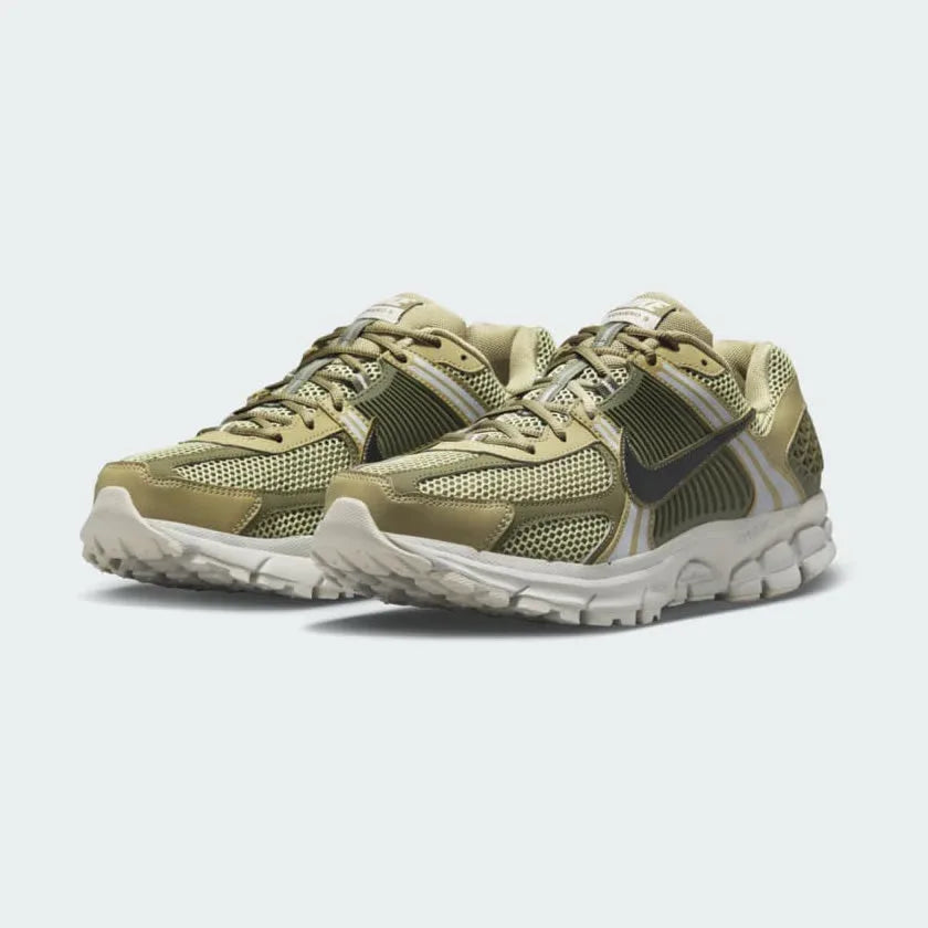 Emphasising the technical, Y2K running silhouette and the professional distribution of the neutral olive and light bone tones.