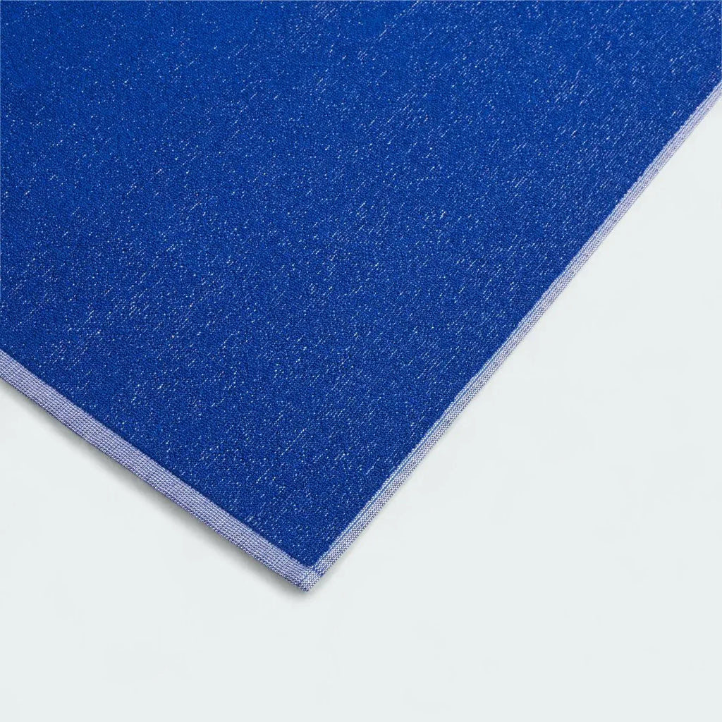 Close-up detail of the Adidas Cotton Towel in royal blue, showing the plush texture of the absorbent 100% cotton material.