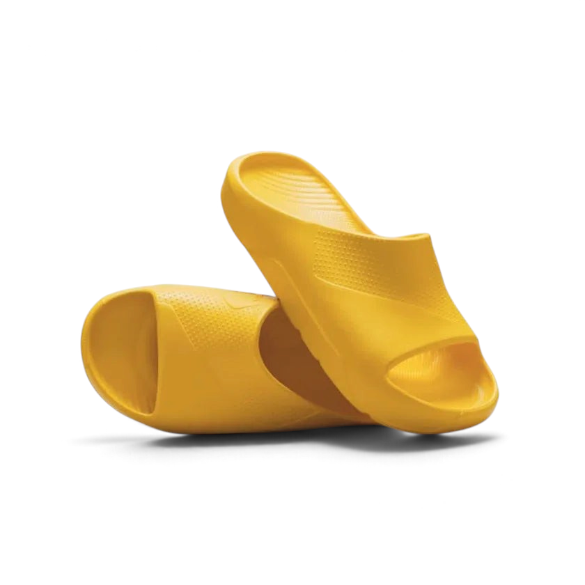 Trade Sports Air Jordan Post Slide in vibrant yellow ochre, featuring a one-piece molded foam asymmetrical design.