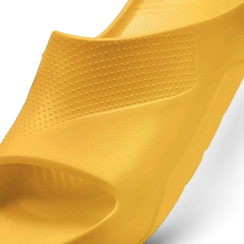 Trade Sports Air Jordan Post Slide in vibrant Yellow Ochre featuring a one-piece molded foam construction.