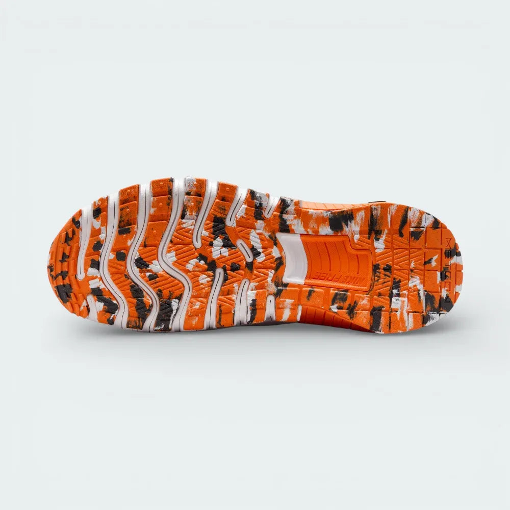 View of the rubber outsole, showcasing the deep flex grooves in the forefoot and the flat, stable rubber traction in the heel.