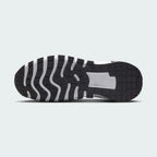 View of the outsole of the Nike Free Metcon 5 Men's orange training shoes, showing the multi-directional traction pattern for versatile gym performance.