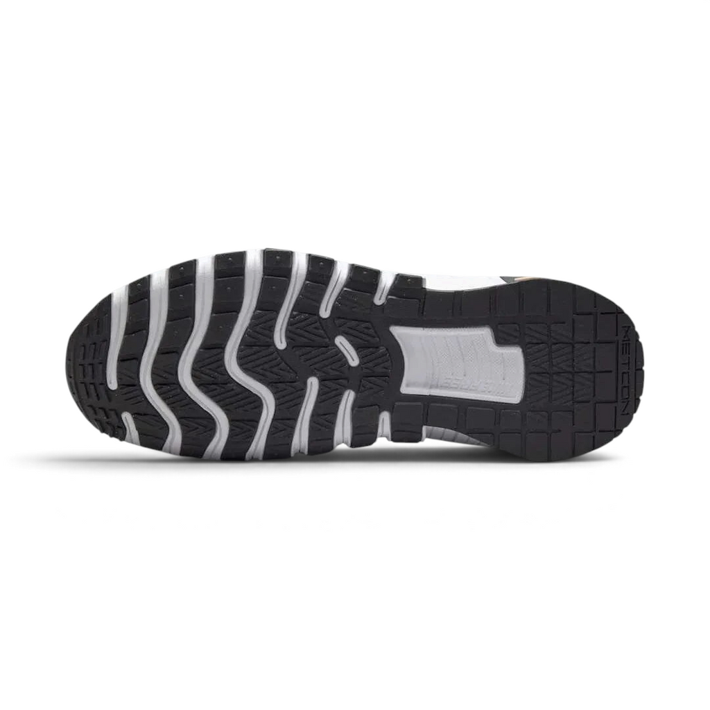 View of the outsole of the Nike Free Metcon 5 Men's orange training shoes, showing the multi-directional traction pattern for versatile gym performance.
