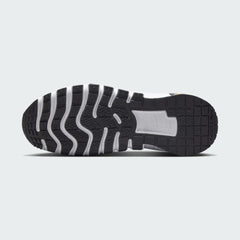 View of the outsole of the Nike Free Metcon 5 Men's orange training shoes, showing the multi-directional traction pattern for versatile gym performance.