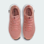Top-down view of a pair of Nike Free Metcon 5 Men's training shoes in orange, highlighting their athletic silhouette and lace-up closure.