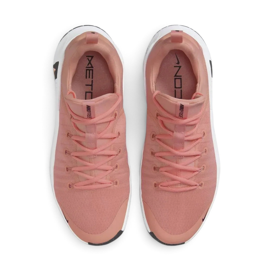 Top-down view of a pair of Nike Free Metcon 5 Men's training shoes in orange, highlighting their athletic silhouette and lace-up closure.