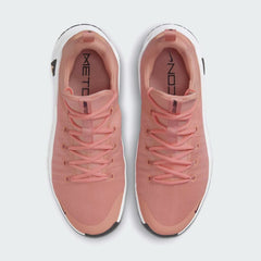 Top-down view of a pair of Nike Free Metcon 5 Men's training shoes in orange, highlighting their athletic silhouette and lace-up closure.