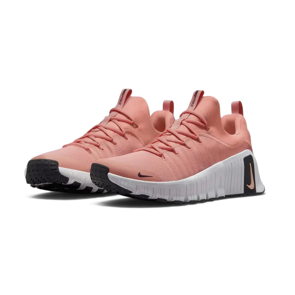 Angled view of two Nike Free Metcon 5 Men's orange and black training shoes, side by side, showcasing their dynamic design and supportive structure.