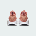 Rear view of the Nike Free Metcon 5 Men's orange training shoes, focusing on the wide, flat heel for lifting stability and subtle branding.