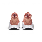 Rear view of the Nike Free Metcon 5 Men's orange training shoes, focusing on the wide, flat heel for lifting stability and subtle branding.