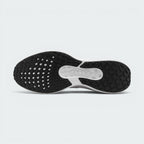 Bottom-up view of the Nike Air Winflo 11 outsole, displaying the black rubber grid traction pattern and a central white groove revealing the embossed "AIR" logo.