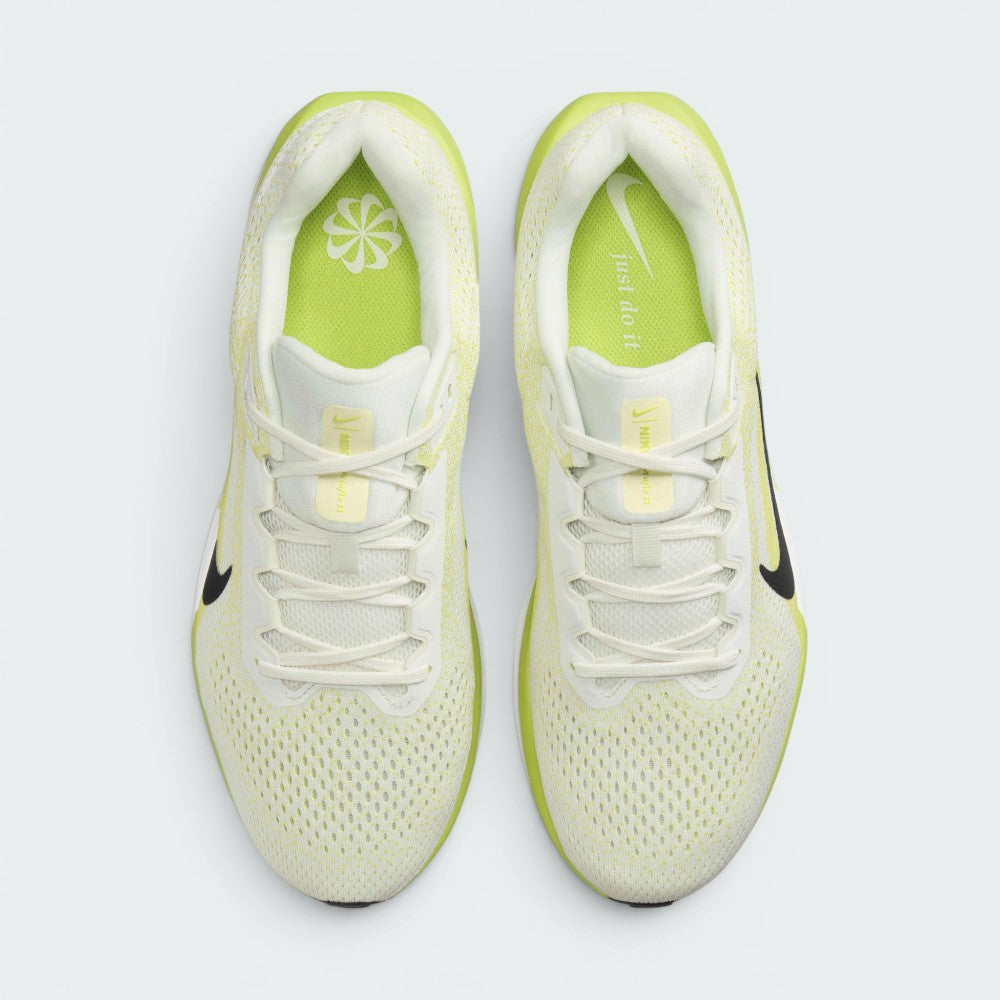 Top-down view of the pair of Nike Air Winflo 11 shoes side by side, showing the off-white laces, sail engineered mesh, and bright lime green insoles printed with white Nike branding.