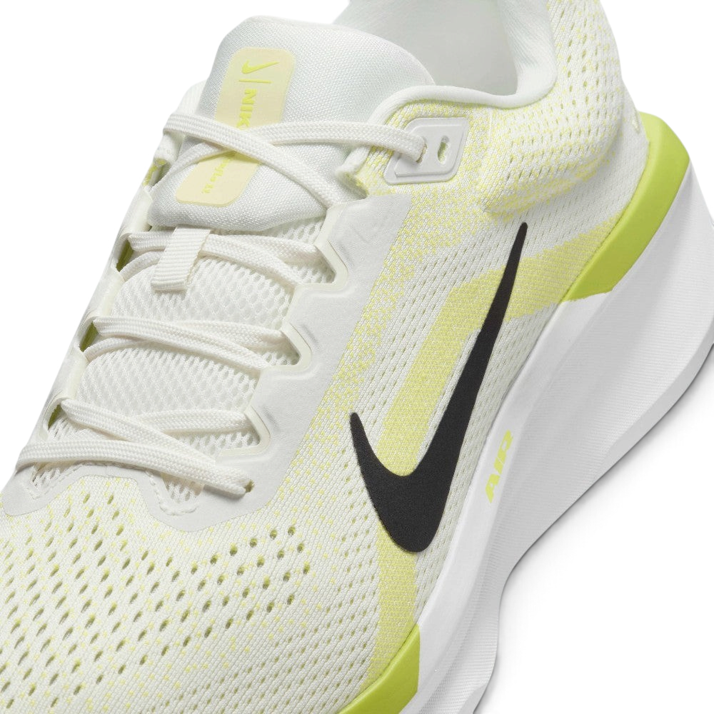 Close-up detailed view of the midfoot section, showcasing the textured sail mesh upper, a clean black Swoosh, white laces, and "AIR" printed in yellow on the chunky white midsole.