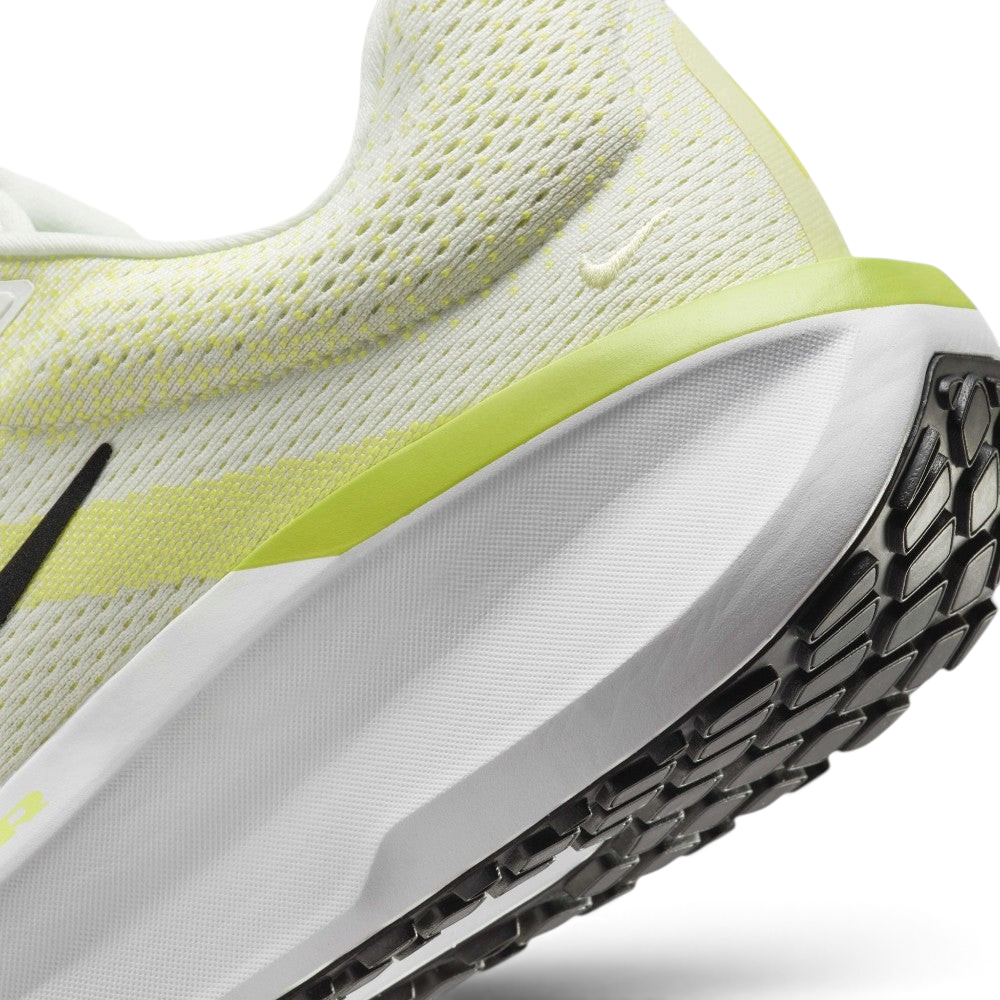 Close-up detailed view of the heel section, highlighting the breathable knit pattern, a tiny embroidered Swoosh, and the sleek junction where the lime green trim meets the sculpted white midsole.