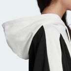 Detailed zoom on the hood and drawcord of the Adidas Women's Oversized Bellista Hoodie, highlighting the thick fabric and adjustable feature.