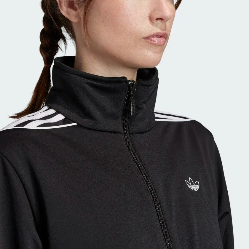 Close-up zoom on the Adidas Women's Archival Track Jacket in black, showing the smooth knit fabric texture and the embroidered white Trefoil logo detail on the chest.