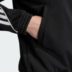 Detailed zoom on the ribbed stand-up collar and full zipper of the Adidas Women's Archival Track Jacket, highlighting the smooth material.