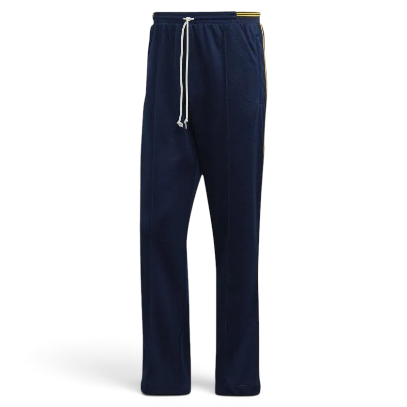 Adidas Recycled Track Pants Men's in dark blue, front view showing elastic waistband, drawcord, side pockets, and contrasting 3-Stripes down the legs.