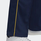 Close-up zoom on the Adidas Recycled Track Pants Men's in dark blue, showing the smooth fabric texture and the embroidered Adidas Trefoil logo.