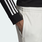 A high-detail close-up of the R.Y.V. branding and the zip pocket closures.