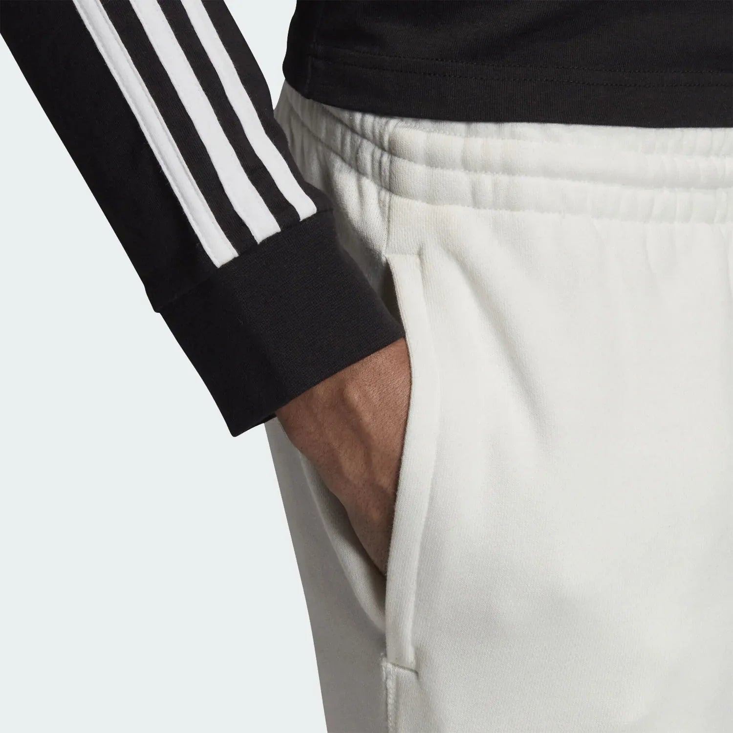 A high-detail close-up of the R.Y.V. branding and the zip pocket closures.