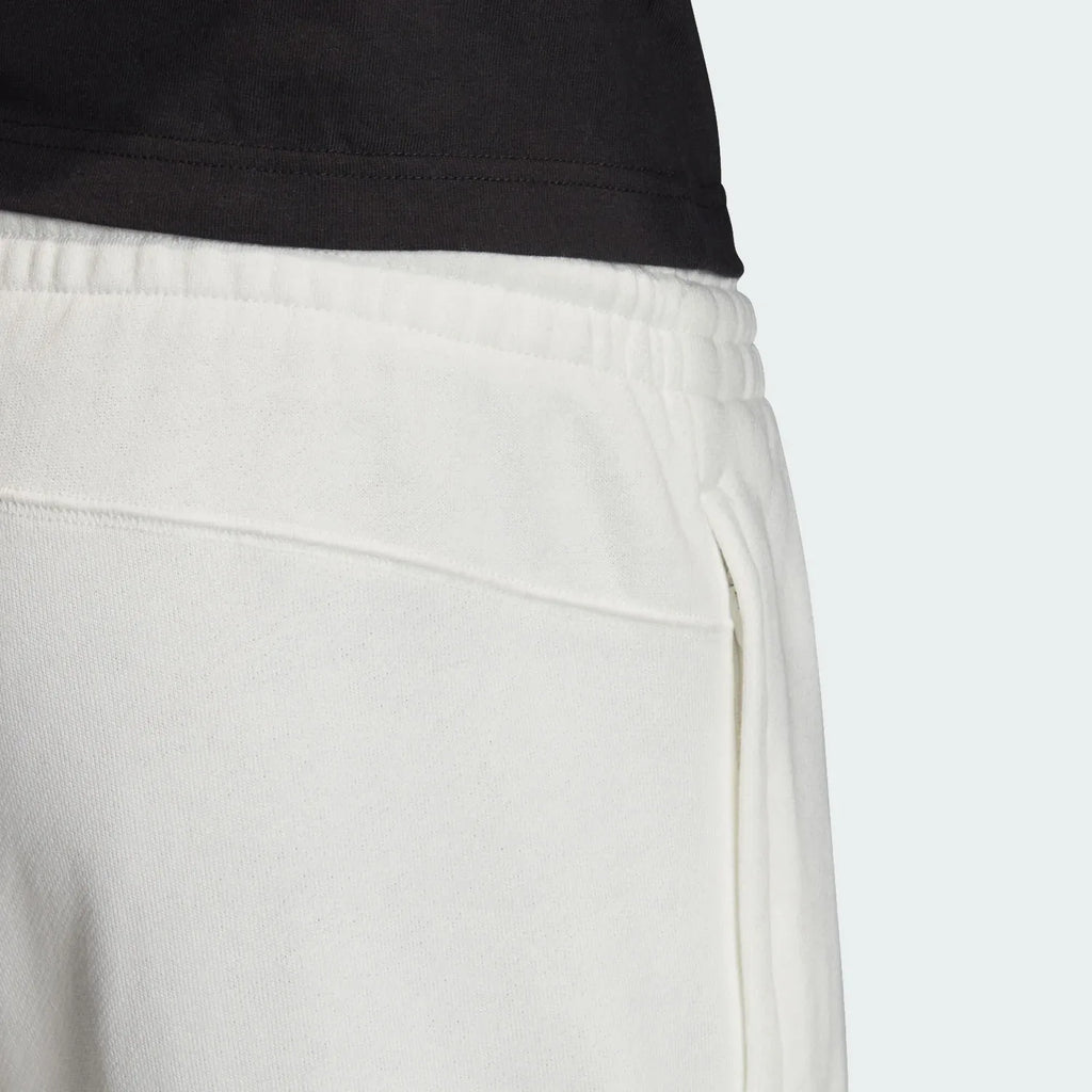 Focuses on the plush French terry interior and the crisp finish of the white cotton.
