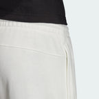 Focuses on the plush French terry interior and the crisp finish of the white cotton.