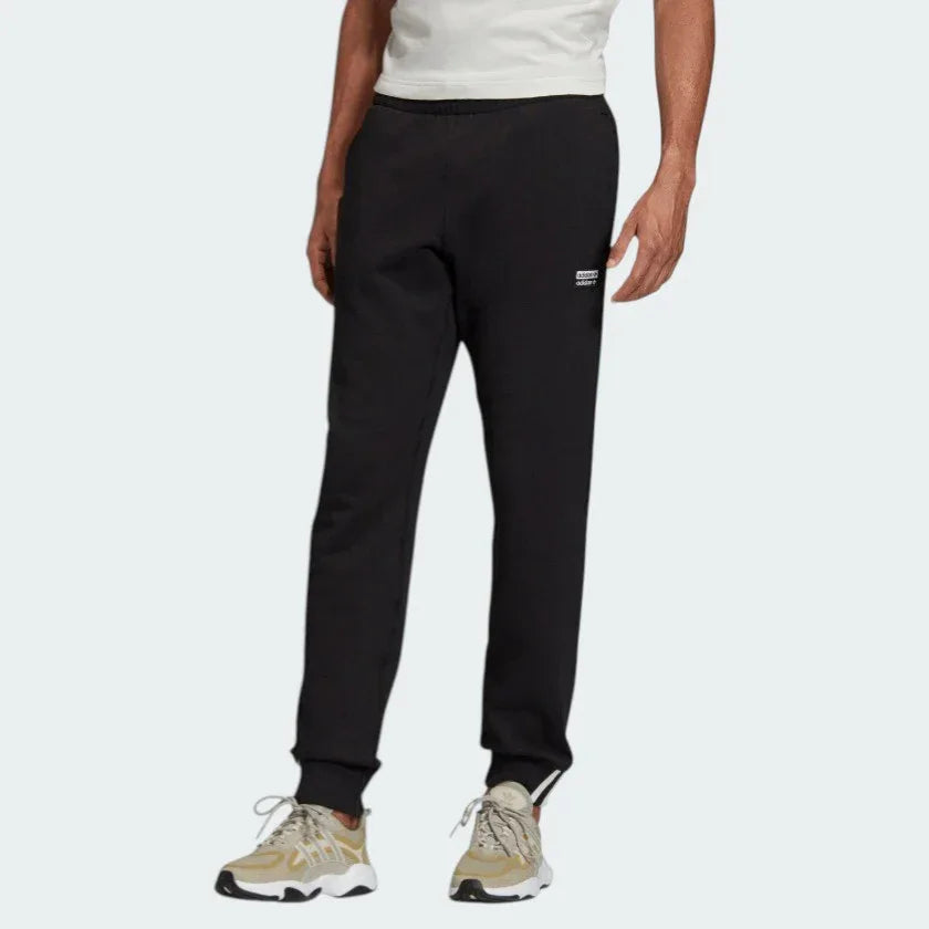 Adidas R.Y.V. Sweat Pants Men's in black, front view showing elastic waistband, drawcord, tapered legs, and side pockets. Main image