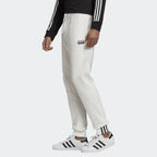 Highlights the tapered leg and the signature stacked logo badge.
